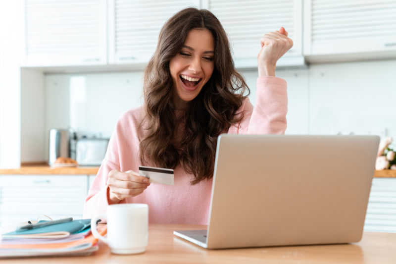  woman happy on laptop