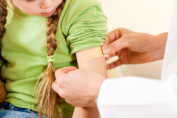 Little girl getting the measles vaccine, why get vaccinated lg