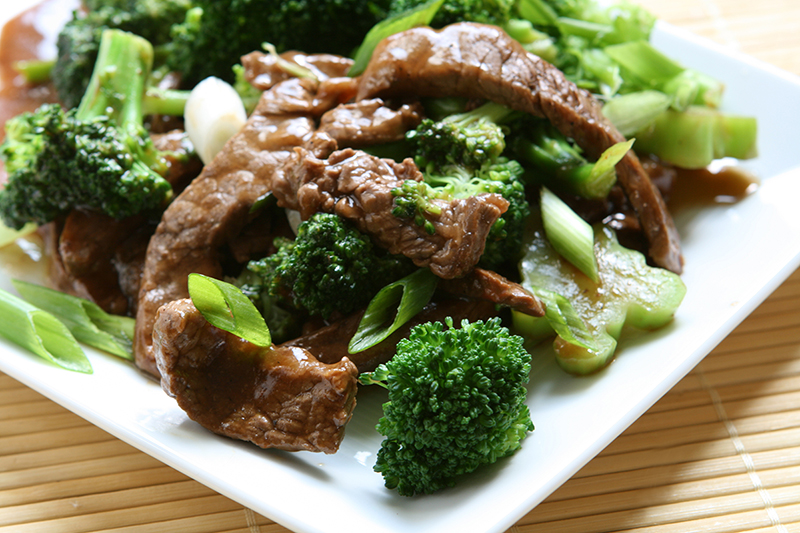 Beef and broccoli stir fry sitting on a plate, recipe