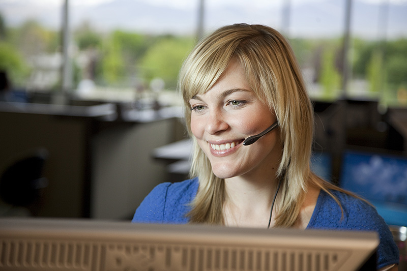 Lady talking on the phone helping someone process their insurance claim