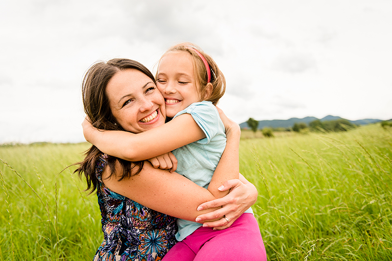 Mother and daughter hugging, reasons why hugging is good for you