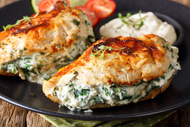 Healthy spinach stuffed chicken on a plate, recipe