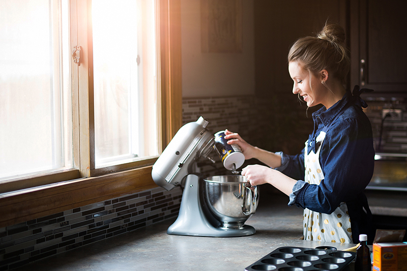 Woman who loves to bake, mixing ingredients in her kitchen