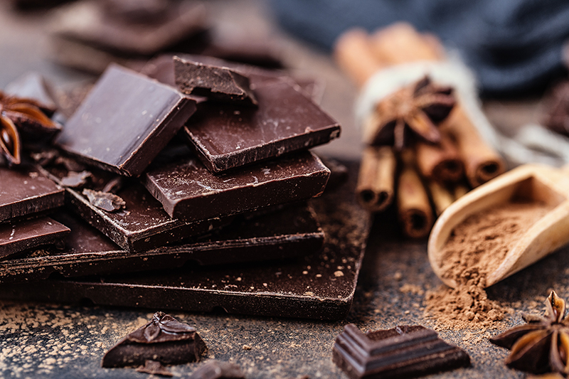 Chunks of dark chocolate on a table, benefits of dark chocolate