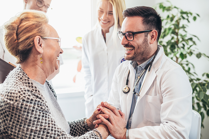 Doctor with patient, explaining to her what is medical home? lg