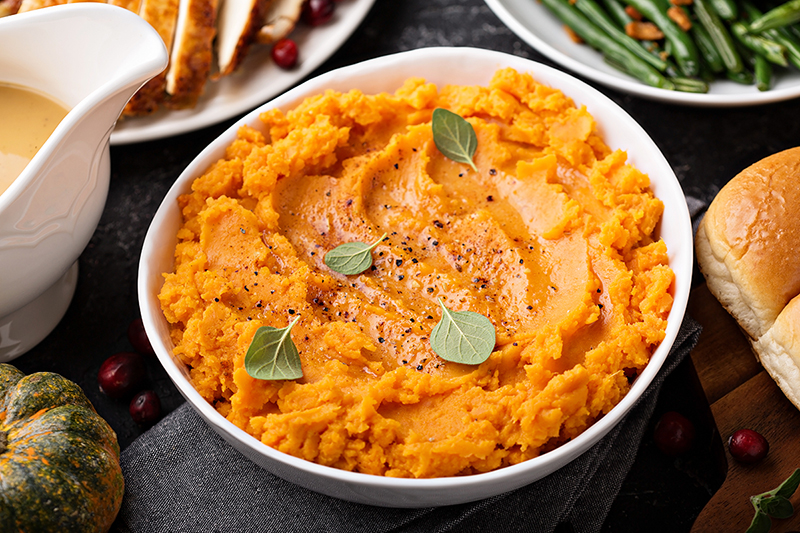 Healthy mashed sweet potatoes in a white bowl, recipe