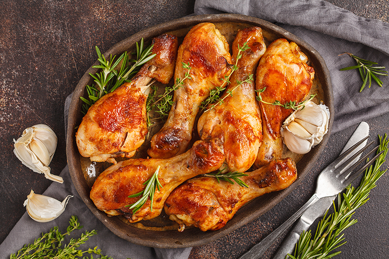 Cranberry rosemary chicken on a plate with garlic, recipe