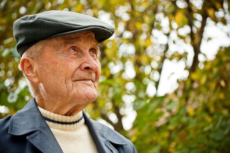 Elderly man enjoying outside.