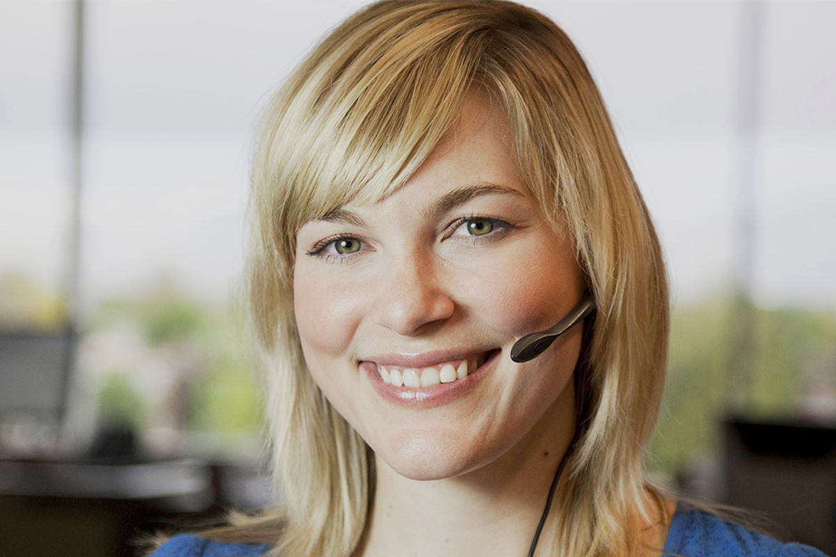 woman on a call using microphone and smiling
