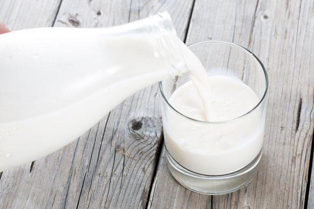 milk being poured into glass