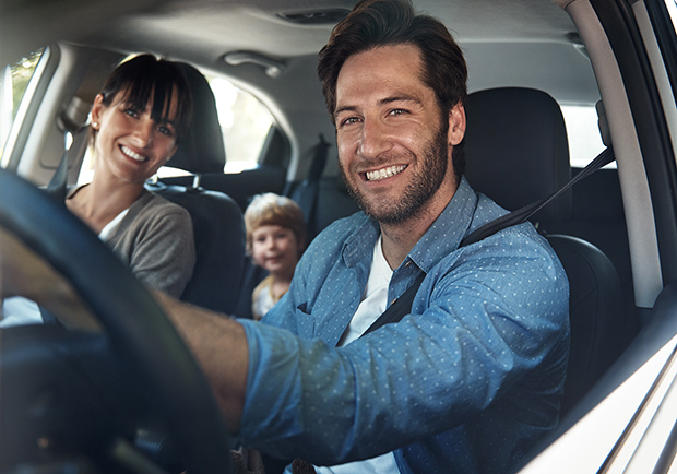 Family driving together in a car. Tips and methods to stay safe while traveling