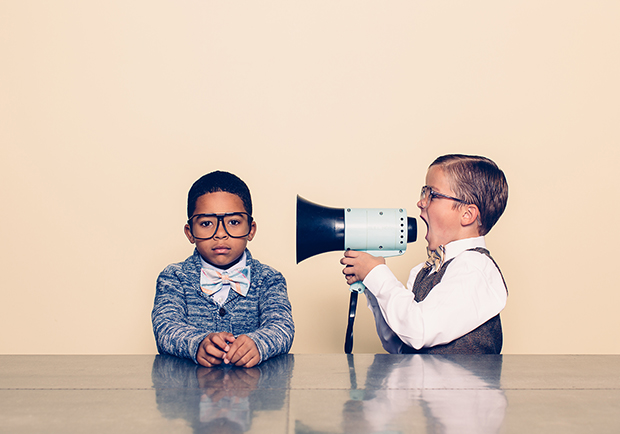 Two boys, one with a megaphone. How to communicate better. 