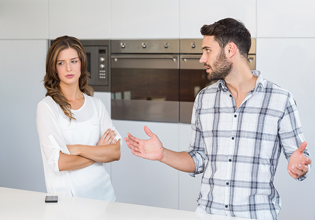 Improve your body language, man and woman in kitchen