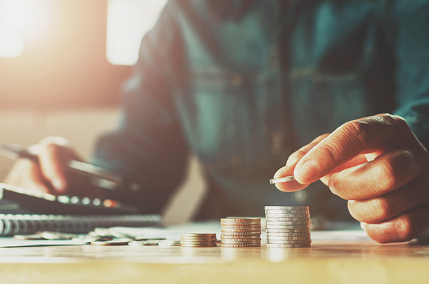 A man counting his change. Tips for saving money