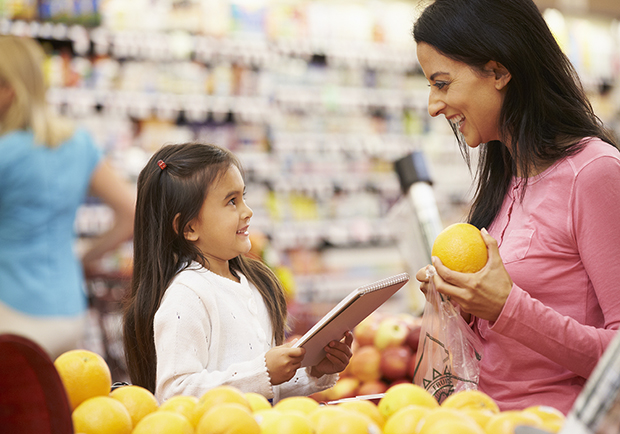 Mother and daughter grocery shopping, teach your child about positive body image