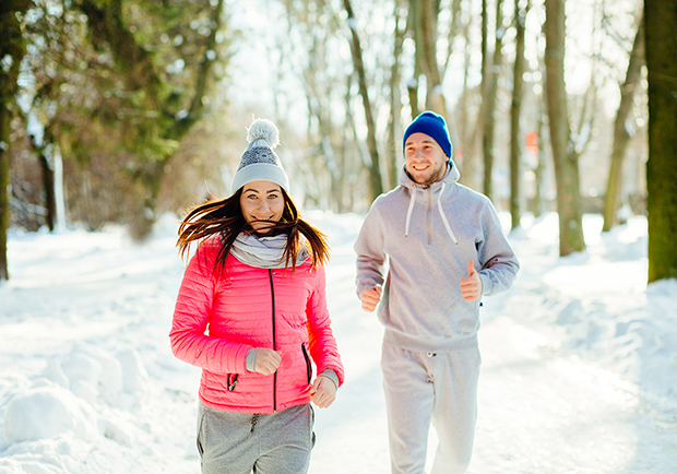 Man and woman running during the winter, ways to boost immunity in winter