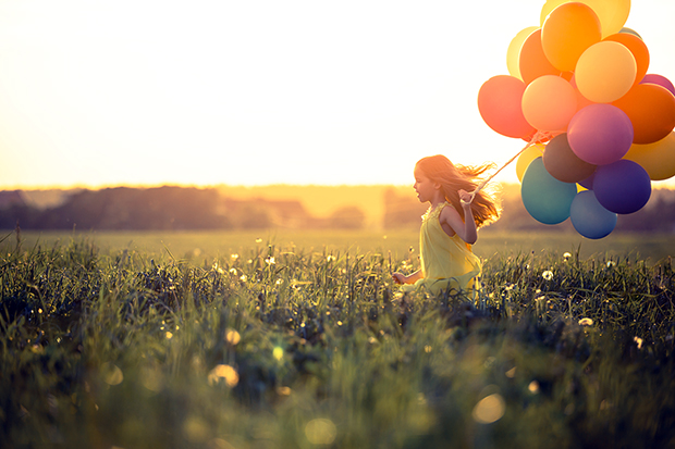 Girl running with balloons, 7 ways to find happiness 