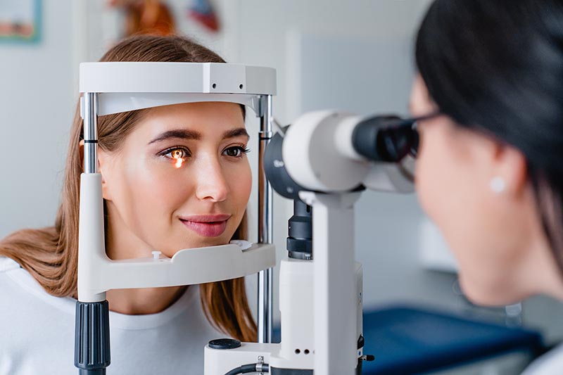 Women receiving a routine eye exam.