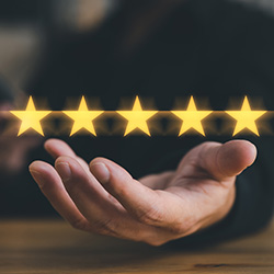Open hand with 5 stars hovering above
