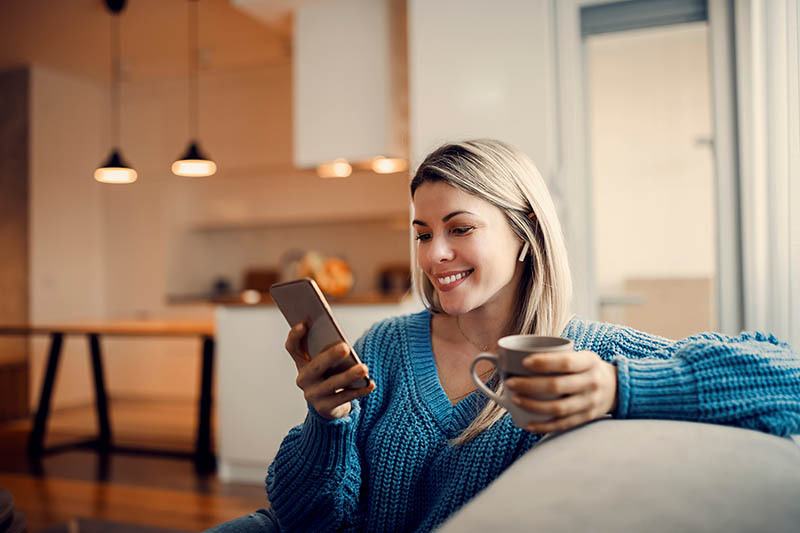 Young happy women checking mobile app.